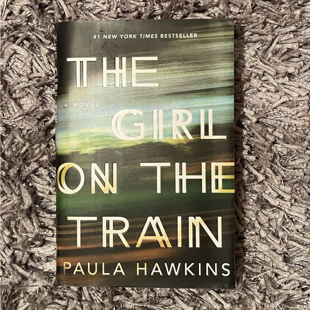 The Girl on the Train hardcover novel by Paula Hawkins. Like new condition.